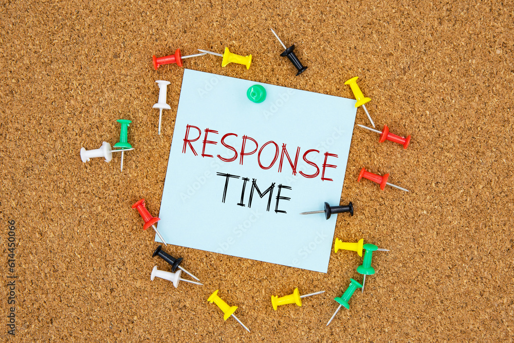 Poster response time text on light blue post-it paper pinned on bulletin cork board surrounding by multi co