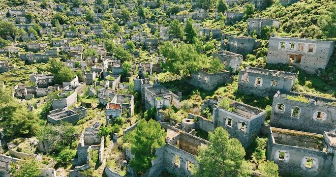 Drone video capturing the eerie beauty of the abandoned stone houses of Kayak&ouml;y, a historical gem in Fethiye, Muğla, Turkey.