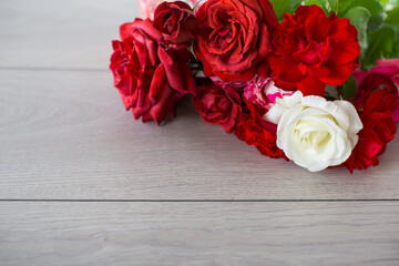 Floral background of pink, red and other roses