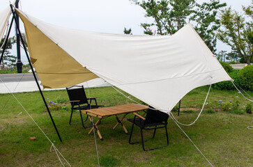 Various field tents on green lawn in campsite area at parkland