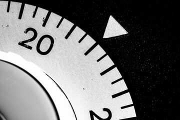 monochrome close-up of an old analog laboratory timer set to 22