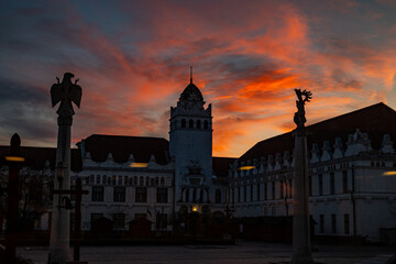 Fototapeta na wymiar Old lofty building at sunset