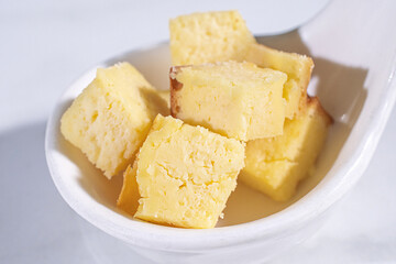 sliced butter cake on white plate .