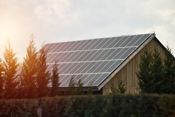 Obraz premium Concept of sustainable future. Solar roof installation company. Solar Panels and Photovoltaic.