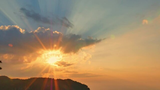 aerial view of Majestic sunset or sunrise landscape Amazing light of nature cloudscape sky..The rays of the sun shine through the clouds at beautiful gradient sunset..Nature environment background.