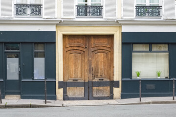 Paris, an ancient wooden door, typical building in the Marais