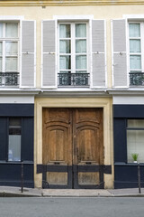 Paris, an ancient wooden door, typical building in the Marais