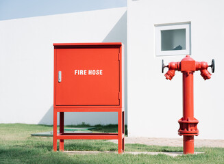 a fire hydrant and a fire box in a field