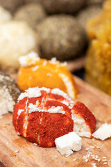 Cheese in spices. Soft cheese tasting. Soft focus.
