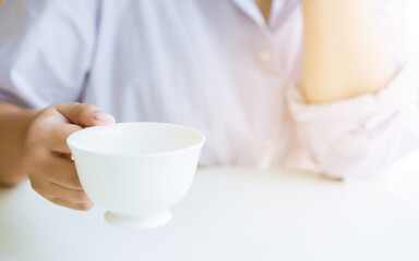 Woman's hand holding a cup of coffee