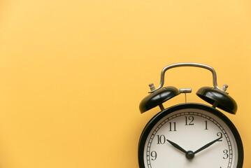 Concept of time, reminder, countdown, alert, deadline. Alarm clock isolated on yellow...