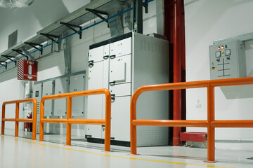 Naklejka premium a row of orange metal railings in factory