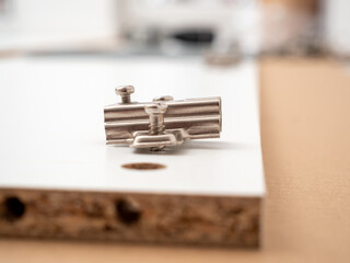 Pieces of furniture and tools in the process of assembly. Furniture assembly.