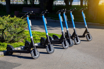 Electric scooters in the parking lot. Scooter rental for a trip around the city.
