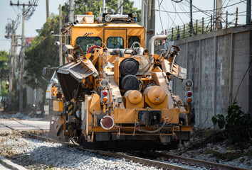 Maintenance railway on working a track tamping machine works on the tracks