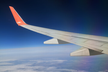 Fototapeta na wymiar airplane wing sky view porthole