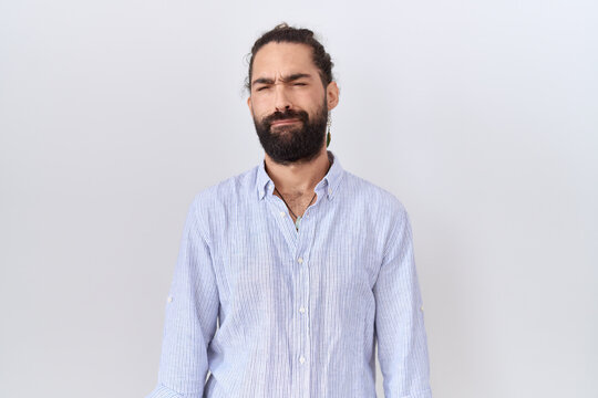 Hispanic man with beard wearing casual shirt depressed and worry for distress, crying angry and afraid. sad expression.