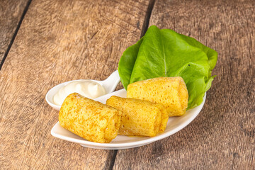 Stuffed pancakes with cream sauce