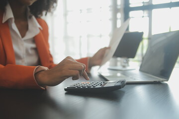 Portrait of Asian young female working on laptop at office