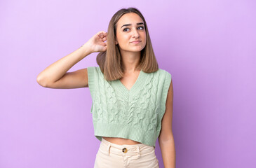 Young caucasian woman isolated on purple background having doubts