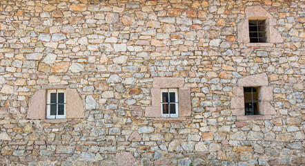 Antique of stone wall and window slot from the ancient city