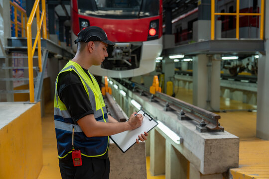 Railway technicians check train schedules and perform repairs and maintenance of trains in the depot.