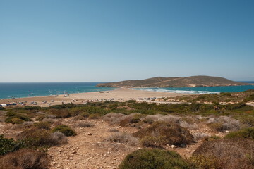 View of the beach of Prasonisi. It is a rocky island connected with island of rhodes Greece.