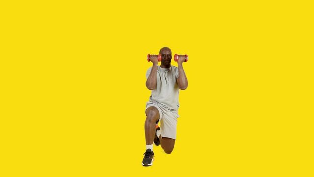 African strong man doing dumbbell Arnold press
