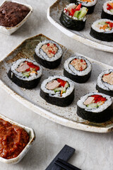 Homemade futomaki sushi rolls with vegetables and canned tuna fish