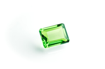 Glass cut fake green tourmaline with a emerald cut isolated on white background  