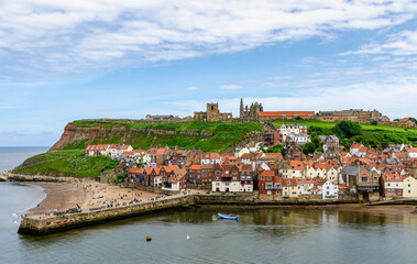 Obraz premium The landscape of port in Whitby. Beautiful day in Yorkshire, England. A beautiful town where the story of Dracula was created.