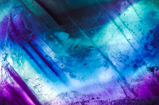 Fluorite layered slice. macro detail texture background. close-up polished semi-precious gemstone.