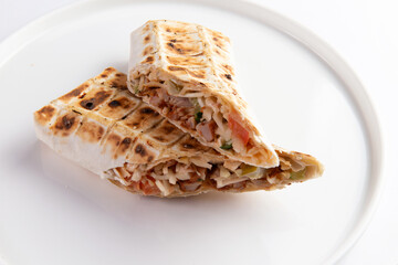 Shawarma. A traditional dish of meat and foschi wrapped in flatbread.