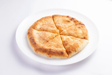 Traditional cheese pie. Khachapuri. On a white background.