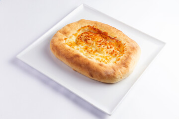 Traditional cheese pie. Khachapuri. On a white background.