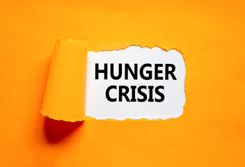 Hunger crisis symbol. Concept words Hunger crisis on beautiful white paper on a beautiful orange background. Business, support and Hunger crisis concept. Copy space.