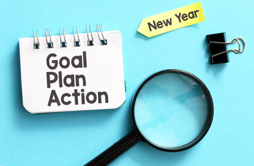 New year goal,plan,action text on notepad