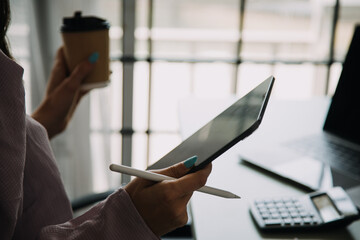 Young adult happy smiling Hispanic Asian student wearing headphones talking on online chat meeting using laptop in university campus or at virtual office. College female student learning remotely.