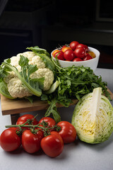 Fresh farm vegetables in the background. Close up