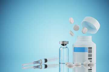 Pills with packaging on a blue table. Syringe for injection. Glass ampoule with medicine. Treatment...