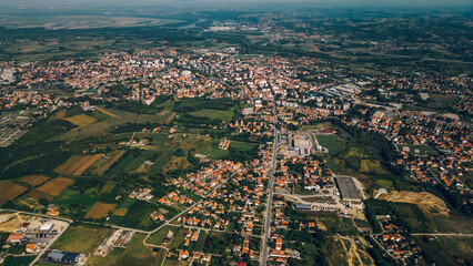 Areal drone footage of a suburb small town with private houses