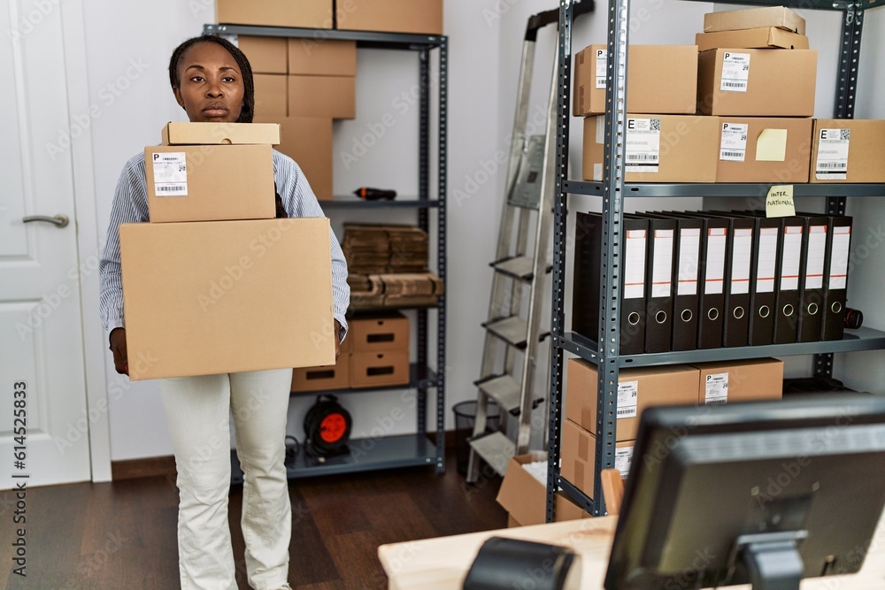 Canvas Prints African american woman ecommerce business worker holding packages at office