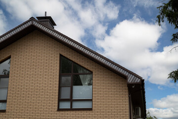 The roof is made of tiles.Roof tiles installed on a new house.