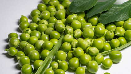 green  fresh peas on a white background