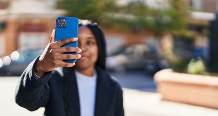 African american woman smiling confident making selfie by the smartphone at street