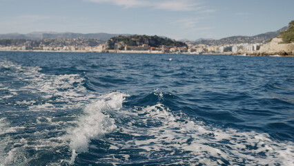 Nice port from a boat with trail on a sea surface