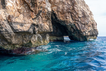 Fototapeta na wymiar Malta, near the habour of Wied iz-Zurrieq, approching by boat the beautiful blue caves and blue lagoon. 