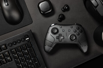 Gaming controller amidst various modern devices