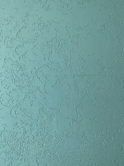 Textured plaster, turquoise wall.