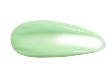 A dab of fresh light green cream or cucumber face mask. With granules and flecks. On a white background